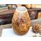 A gourd vase with sunflowers burned on the front and the inspirational phrase "bloom where you are planted".
